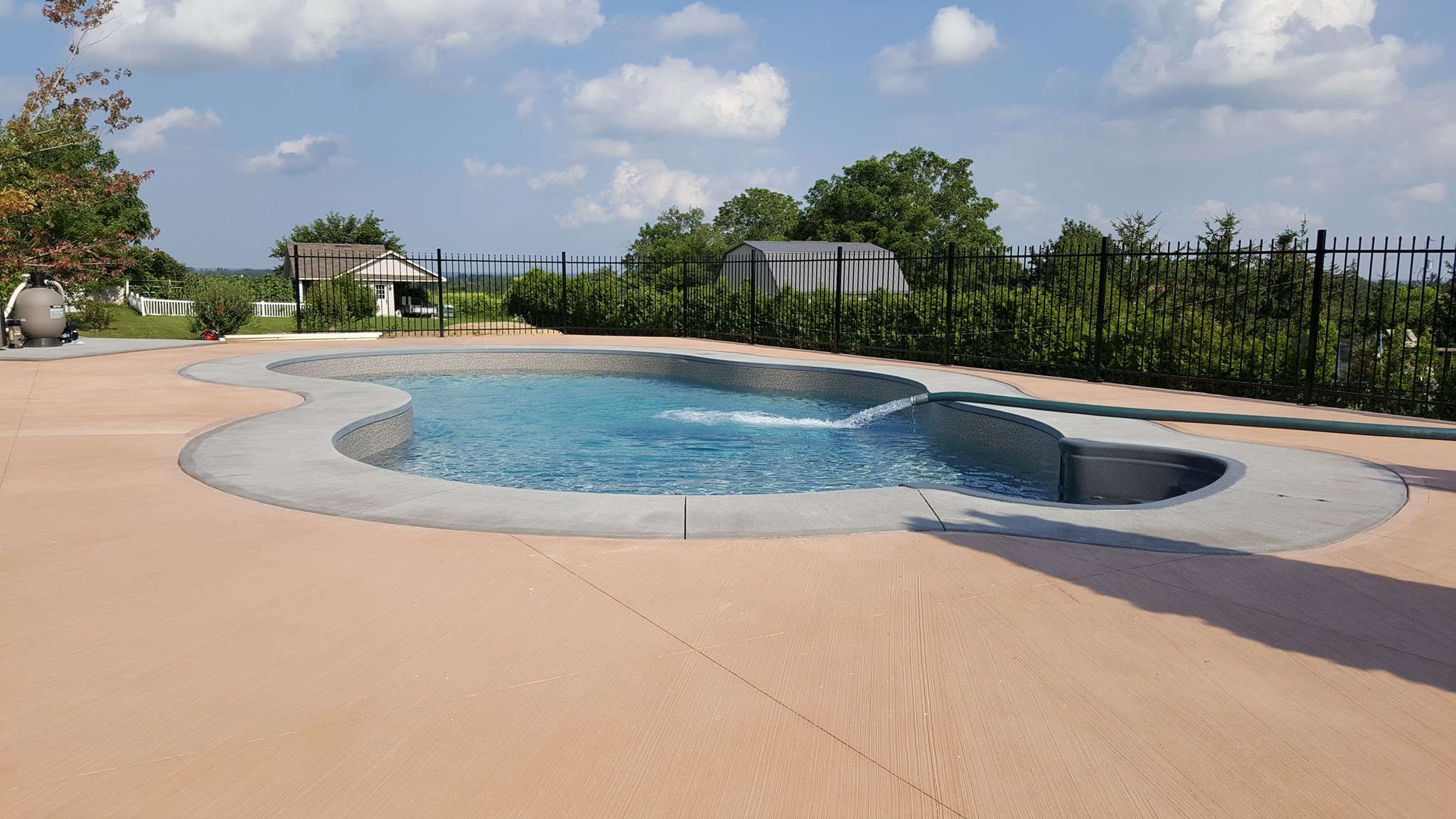 J and M Water Truck filling up a residential swimming pool in Brantford Ontario region.