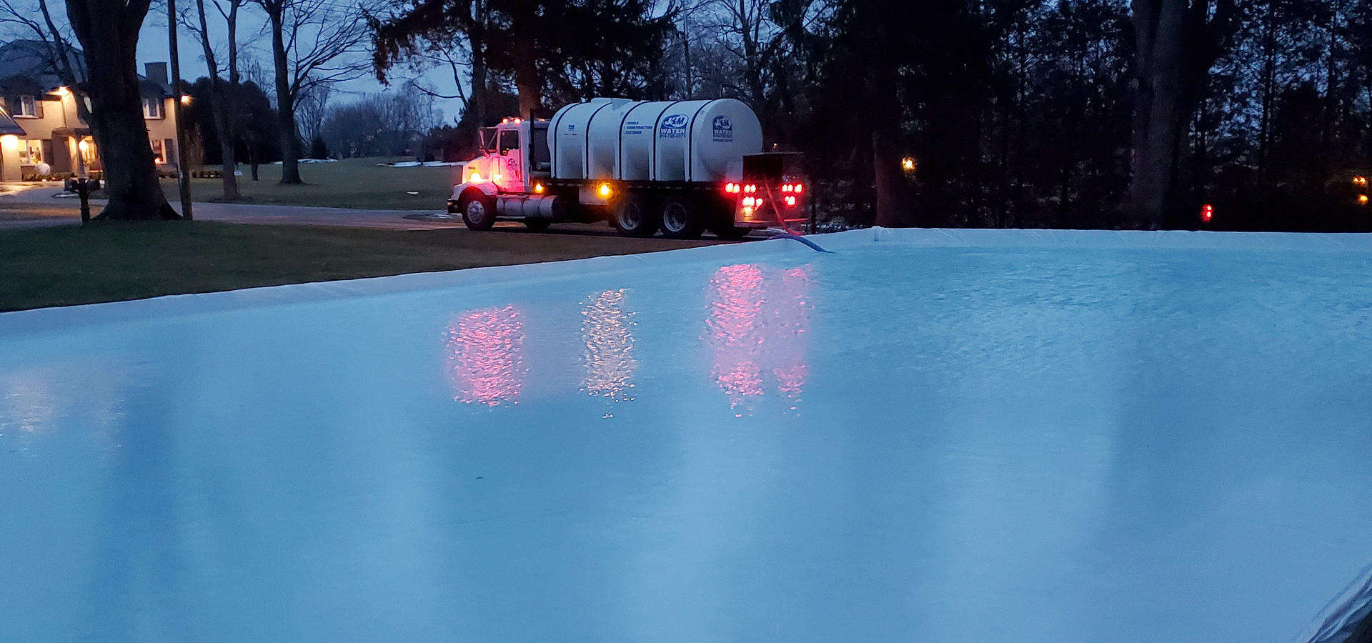 J and M Water Truck filling up an ice rink in Brantford region.